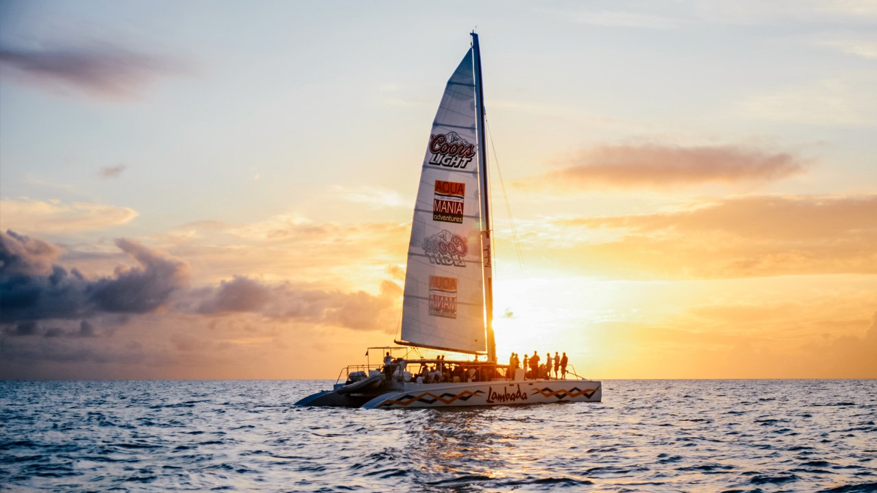 Catamaran sailing at sunset during the Lambada Sunset Sail in St. Maarten.
