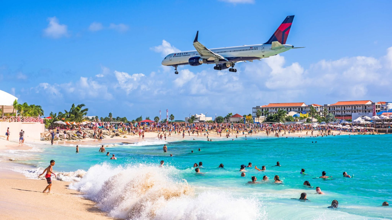 Airplane landing over Maho Beach in St. Maarten